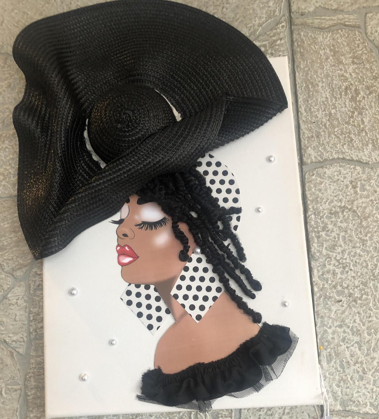A handmade greeting card with a Black woman wearing a large black hat. 