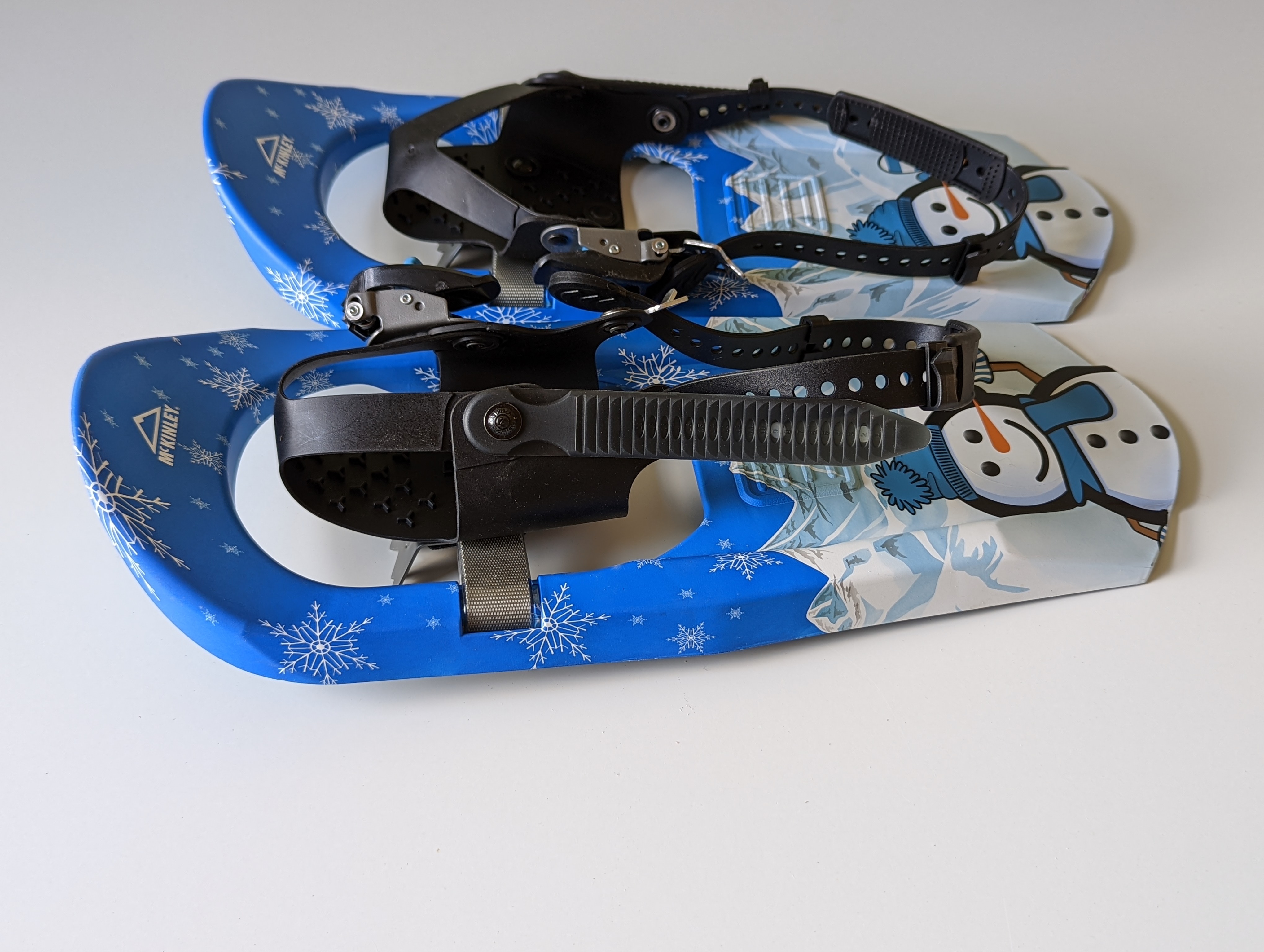 Kids snowshoes with a snowman image on the heal